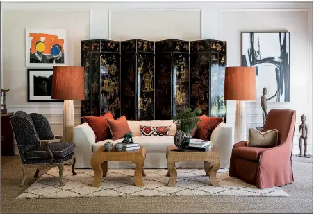  ?? Photo courtesy of Angie Seckinger ?? A dramatic decorative screen anchors a room by designer Josh Hildreth.