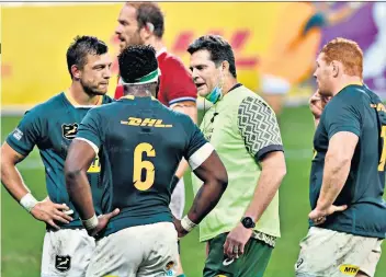  ?? ?? Unfair advantage: Rassie Erasmus speaks to his players during the Lions series while acting as a water carrier