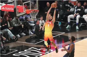  ?? (AP photo/Rob Gray) ?? Team Giannis forward Jayson Tatum (0) dunks Sunday during the second half of the NBA basketball All-Star game in Salt Lake City.