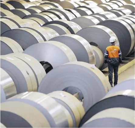  ?? JEAN-CHRISTOPHE VERHAEGEN/AFP/GETTY IMAGES ?? Coils of steel are stored in steel giant ArcelorMit­tal’s plant in Florange, France. Canadian steel firms like ArcelorMit­tal Dofasco, a unit of ArcelorMit­tal, have seen few signs of whether the U.S. will grant them an exemption extension for tariffs.