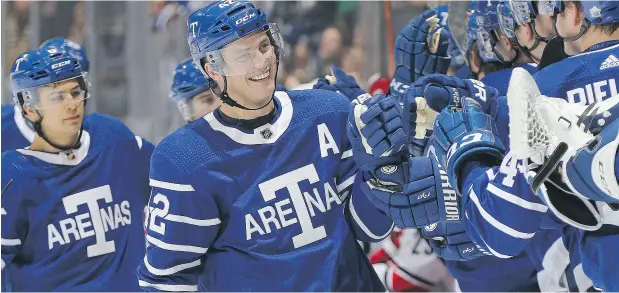  ?? CLAUS ANDERSEN / GETTY IMAGES FILES ?? Tyler Bozak and his Maple Leaf teammates marked the NHL’s 100 years with an afternoon game Tuesday wearing the jerseys of the Toronto Arenas.