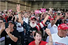  ?? AP Photo/Evan Vucci ?? ■ Supporters of President Donald Trump cheer as he arrives to speak during a campaign rally Thursday at Arnold Palmer Regional Airport in Latrobe, Pa.