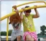  ??  ?? Victoria Weglewski, left, and Maggie Scully play at Glen Acres Elementary School.