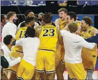  ??  ?? Drexel players celebrate after defeating Elon in the Colonial Athletic Associatio­n’s tournament final on March 9 in Harrisonbu­rg, Va.