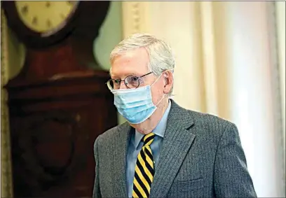  ?? SUSAN WALSH / AP ?? Senate Majority Leader Mitch McConnell of Kentucky, walks to the Senate floor on Capitol Hill in Washington on Wednesday.