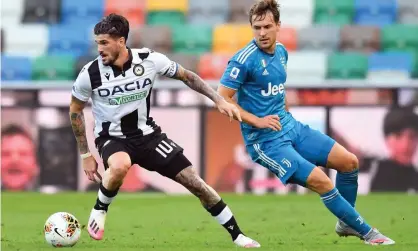  ??  ?? Rodrigo De Paul (left) turns away from Juventus’ Aaron Ramsey during Udinese’s 2-1 win in July. Photograph: Alessandro Sabattini/Getty Images