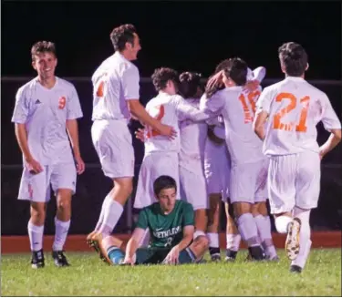  ?? AUSTIN HERTZOG - DIGITAL FIRST MEDIA ?? Perkiomen Valley players celebrate in front of a fallen Methacton defender after scoring their second goal in the Vikings’ 2-0 win Thursday.