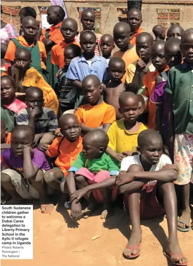  ?? Photos Roberta Pennington / The National ?? South Sudanese children gather to welcome a Dubai Cares delegation to Liberty Primary School in the Ayilo II refugee camp in Uganda