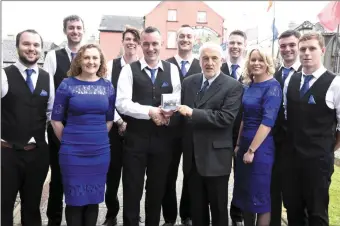  ??  ?? Alan Finn, the leader of the Shandrum Ceili Band presenting Gerry Murphy with a copy of the CD, the Boss Murphy Music Legacy at the launch of the CD at St. Mary’s Church Buttevant, with the band members.