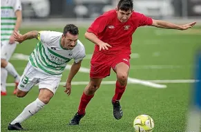  ?? WARWICK SMITH/STUFF ?? Marist’s Adam Cowan, left, and Levin’s Neil Auckram tussle for possession during Marist’s 5-1 win.