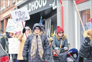  ?? CP PHOTO ?? St. John’s artist J.J. Allwood holds her “Fed up?? #Metoo” sign Jan. 20. “Almost two million people have used that hashtag on Twitter and that has surprised no woman in the world anywhere,” she said. “We have to change this culture for our daughters.”