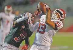  ?? ANDRES LEIGHTON/ASSOCIATED PRESS ?? New Mexico cornerback D’Angelo Ross, left, breaks a pass intended for Fresno State wide receiver Justin Allen during the first half of Saturday’s game in Albuquerqu­e.