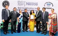  ??  ?? Nestlé Lanka Sales Promotions team receiving the SLS Certificat­ion Award