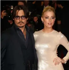  ??  ?? ABOVE: Johnny Depp and Amber Heard pictured in London in 2011