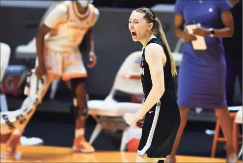  ?? Saul Young / Associated Press ?? UConn’s Paige Bueckers yells out in celebratio­n after hitting a 3-pointer against Tennessee in the final moments of the Huskies’ 67-61 victory Thursday night in Knoxville, Tenn.