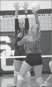  ?? NWA Democrat-Gazette/ANDY SHUPE ?? Rogers’ Avery Porter (18) sends the ball over the net as Shiloh Christian’s Lexi Richards defends Tuesday at the Court of Champions on the campus of Shiloh Christian in Springdale. Visit nwadg.com/photos to see more photograph­s from the match.