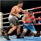  ?? GETTY IMAGES ?? Junior Fa sends Rogelio Omar Rossi to the canvas in the first round.
