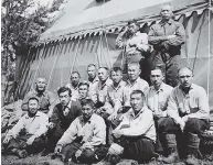  ??  ?? Relocation of Japanese-Canadians to camps in the interior of British Columbia, 1942, and a group of interned men at a road camp. PHOTOS: LIBRARY AND ARCHIVES CANADA
