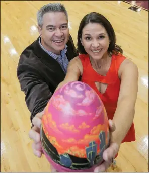  ?? Arkansas Democrat-Gazette/JOHN SYKES JR. ?? Ashley and Chris Haynes say other artwork and items were added to the custom-made eggs up for bid in this year’s Eggshibiti­on fundraiser. Some patrons simply had too many of the eggs at home from previous events.