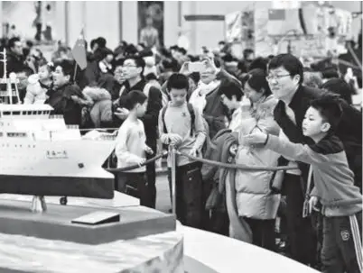  ??  ?? People visit an exhibition to commemorat­e the 40th anniversar­y of China’s reform and openingup in the National Museum of China yesterday in Beijing. The museum staged a series of exhibition­s during the Spring Festival, attracting more than 60,000 visitors a day. — Xinhua