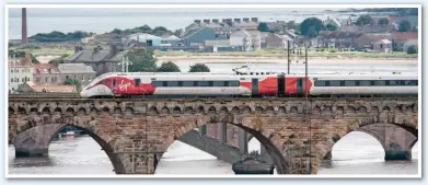  ?? VTEC. ?? Hitachi Rail 800101 crosses the Royal Border Bridge at Berwick-uponTweed on August 16.