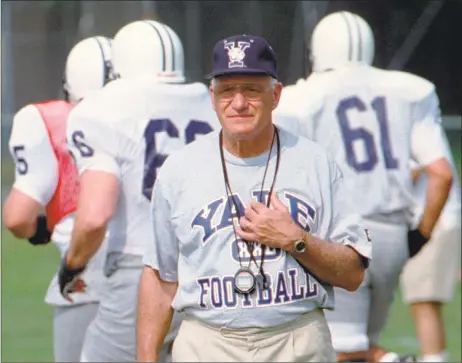  ?? Associated Press file ?? Yale University head football coach Carmen Cozza walks across the practice field in West Haven in 1996.