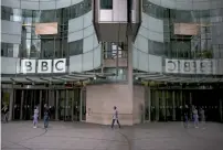  ?? AFP ?? Staff and visitors walk outside the headquarte­rs of the British Broadcasti­ng Corporatio­n in central London. —