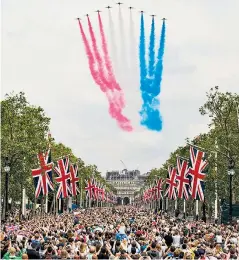  ??  ?? The Royal Air Force Aerobatic Team, the Red Arrows, thrill the crowds on The Mall