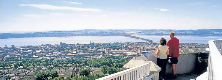  ??  ?? Looking over Dundee’s West End towards the Tay Rail Bridge from the top of the Law.