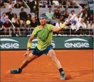  ?? Clive Brunskill / Getty Images ?? Rafael Nadal plays a forehand against Alexander Zverev during the French Open semifinals on Friday.