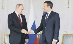  ??  ?? 0 Vladimir Putin and Emmanuel Macron spent three hours in talks