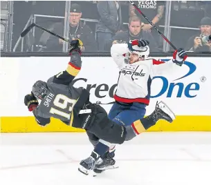  ?? ROSS D. FRANKLIN/THE ASSOCIATED PRESS ?? Vegas winger Reilly Smith hits the deck after colliding with Washington’s John Carlson during Stanley Cup final action Wednesday night in Vegas. Game 3 goes Saturday night in Washington.