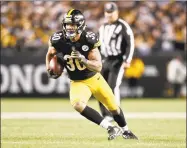  ?? Don Wright / Associated Press ?? Pittsburgh Steelers running back James Conner runs against the Los Angeles Chargers on Dec. 2 in Pittsburgh.