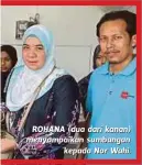  ??  ?? ROHANA (dua dari kanan) menyampaik­an sumbangan
kepada Nor Wahi.