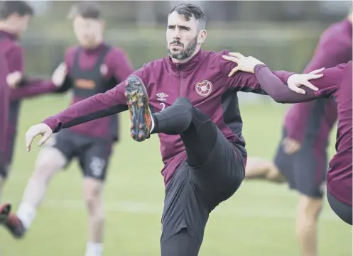  ??  ?? Hearts’ Michael Smith, training at Riccarton ahead of today’s clash with St Johnstone, is looking forward to a run of home matches.