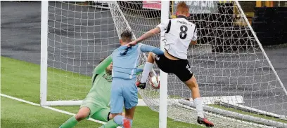  ?? PETER HARMAN ?? Josh Yorwerth scores for Merthyr Town against Slough Town