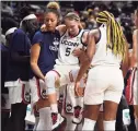  ?? Jessica Hill / Associated Press ?? UConn’s Paige Bueckers (5) is helped off the court after injuring herself in the second half against Notre Dame on Sunday in Storrs.