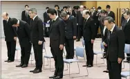  ?? YOSHITAKA SUGAWARA — KYODO NEWS VIA AP ?? Japanese Prime Minister Shinzo Abe, center, observes a moment of silence at 2:46 p.m. when a magnitude 9.0 earthquake struck off Japan’s northeaste­rn coast on March 11, 2011.