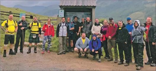  ??  ?? The team pose for a photograph to record their climb on Ben Nevis.