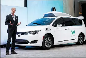  ?? AP/PAUL SANCYA ?? In this January photo, CEO of Waymo John Krafcik introduces a Chrysler Pacifica hybrid, outfitted with Waymo’s sensors and radar, at the North American Internatio­nal Auto Show in Detroit.