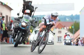  ?? THIBAULT CAMUS/AP ?? Slovenia's Tadej Pogacar crosses the finish line of Stage 20 to take the overall lead in the Tour de France on Saturday.
