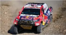  ?? — AFP photo ?? Toyota’s driver Nasser Al-Attiyah of Qatar and his co-driver Mathieu Baumel of France compete during Stage 3 of the Dakar Rally 2021 between Bisha and Wadi Ad-Dawasir in Saudi Arabia.