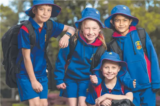  ?? Picture: Kevin Farmer ?? BRIGHT MINDS: Downlands College students (from left) Cohen Moore, Sophie Reynolds, Jaxson Parker and Sasithmi Kevitiyaga­la are excited to welcome prep to Year 3 students from 2023.