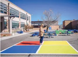  ?? ROBERTO E. ROSALES/JOURNAL ?? Wilson Middle School Principal Teise Reiser walks through an outdoor area where students can play and eat lunch. Campuses at Albuquerqu­e Public Schools are scheduled to reopen Monday for in-person learning.