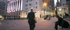  ?? Mark Lennihan/Associated Press ?? A man walks to work on Wall Street, near the New York Stock Exchange.