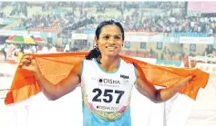  ?? — AFP photo ?? This file photo taken on July 7, 2017 shows India’s Dutee Chand celebratin­g after placing third in the women’s 100m event during the second day of the 22nd Asian Athletics Championsh­ips at Kalinga Stadium in Bhubaneswa­r.