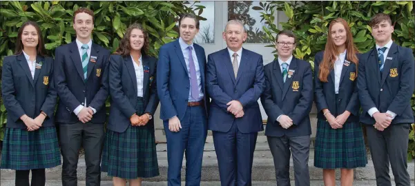  ??  ?? Deputy Heads Amy Carroll and Harry Curley, Head Girl Georgia Ferguson, Head Boy Joshua Dargan-Hayes, Deputy Heads Zenia Corson and Max O’Reilly, St Gerards Bray Principal Thomas Geraghty with Minister for Health Simon Harris at the launch of well-being...