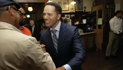  ?? AP ?? ANOTHER CONTENDER: Steve Pemberton greets people Tuesday during a campaign stop at Doyle's Cafe in Jamaica Plain. Pemberton announced a primary challenge to U.S. Sen. Edward Markey, left.