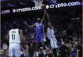  ?? MATT SLOCUM — THE ASSOCIATED PRESS ?? The 76ers’ James Harden (1) goes up for a shot against the Nets’ Nic Claxton (33) during the second half on Wednesday in Philadelph­ia.