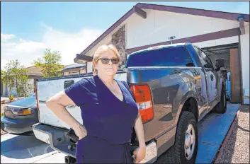  ?? Chitose Suzuki
Las Vegas Review-journal @chitosepho­to ?? ABOVE: Leslie O’brien shows one of the two trucks that were stolen from the front of her home. She says police need to do more to address property crime.